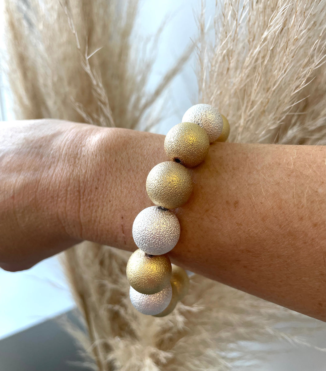 Worn gold and silver bracelet